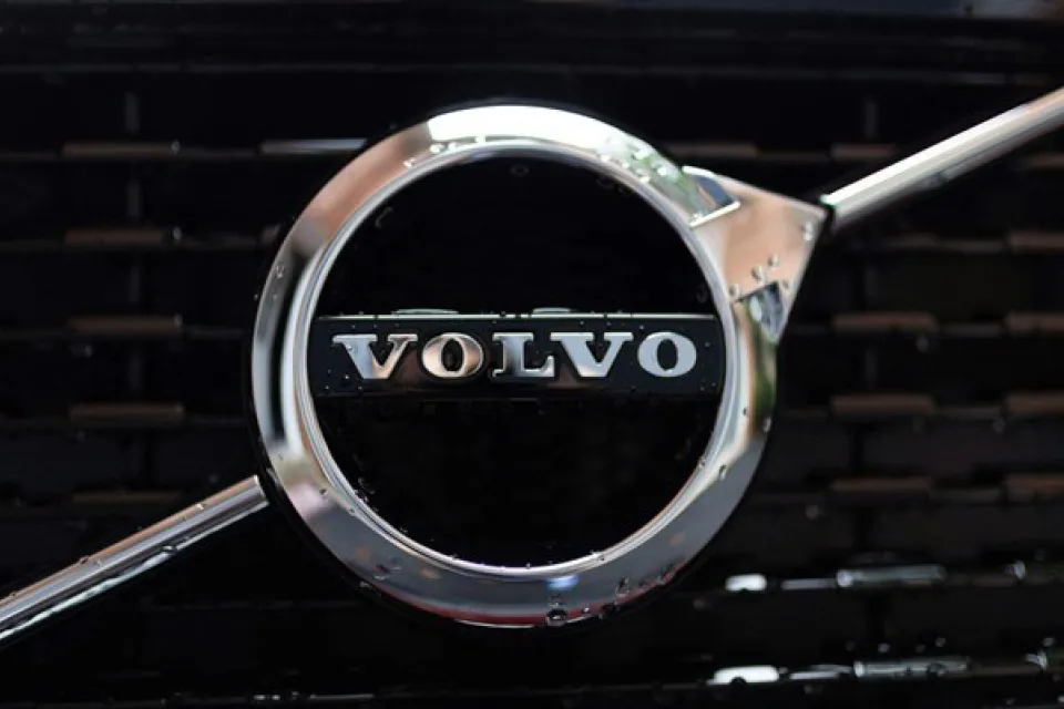 Close-up view of the front grill logo of a Volvo vehicle.